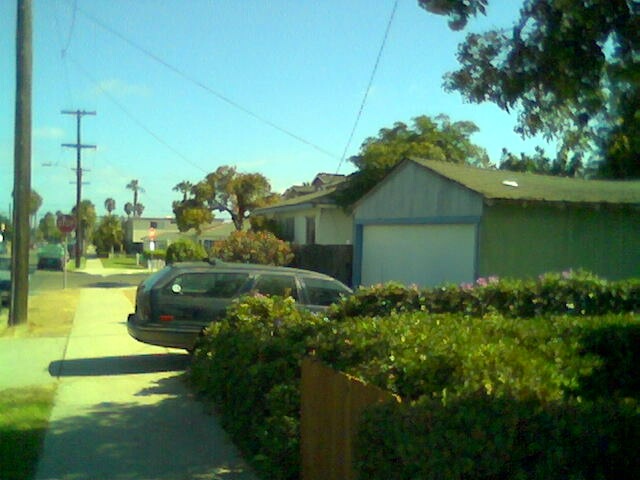 Laurel's car in Gene's driveway