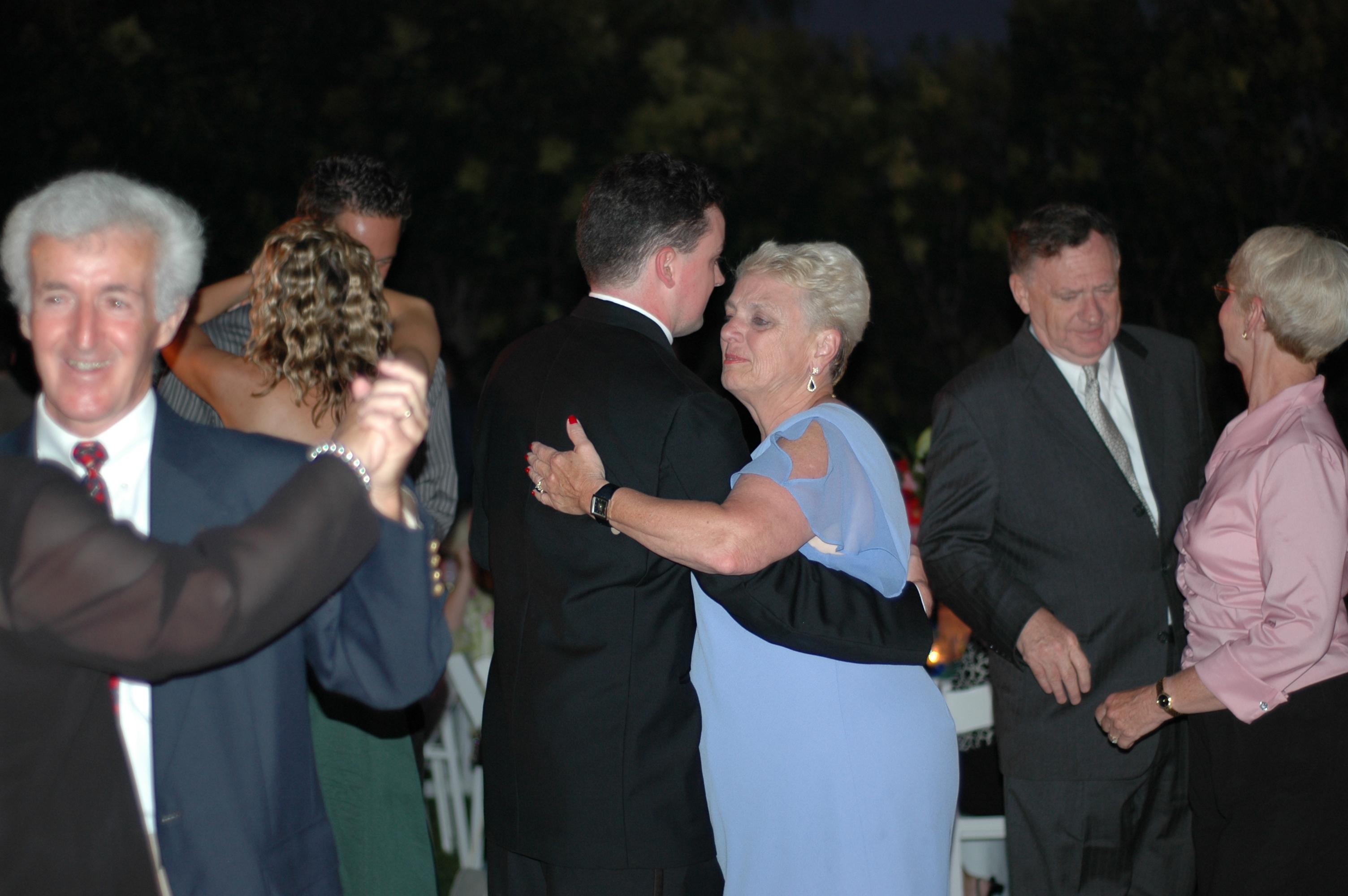 Ted dances with Mrs. Kane
