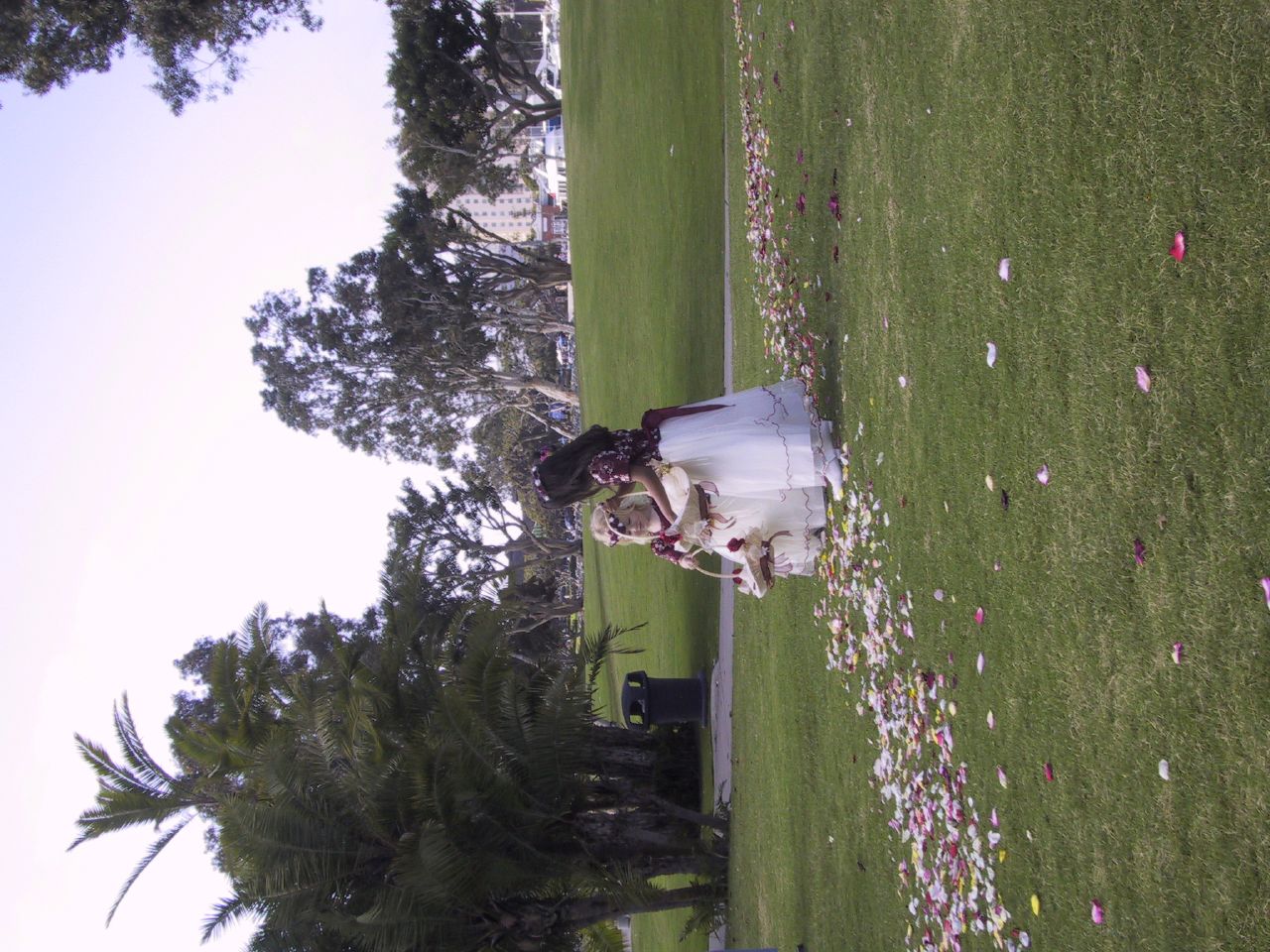 The little one was very confused about why she was dropping flower petals when there were already so many on the ground.