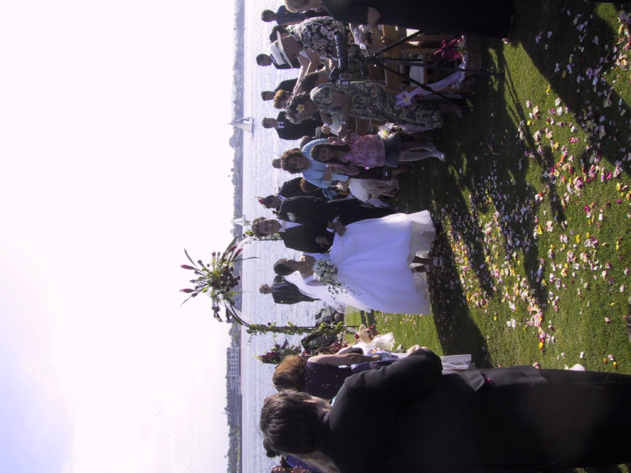 Jun and J.P. come down the aisle