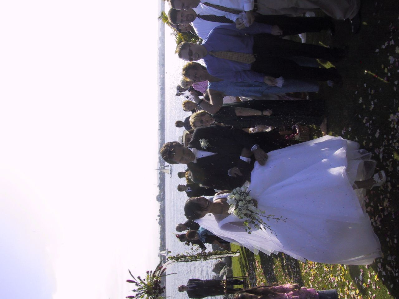 Jun and J.P. come down the aisle