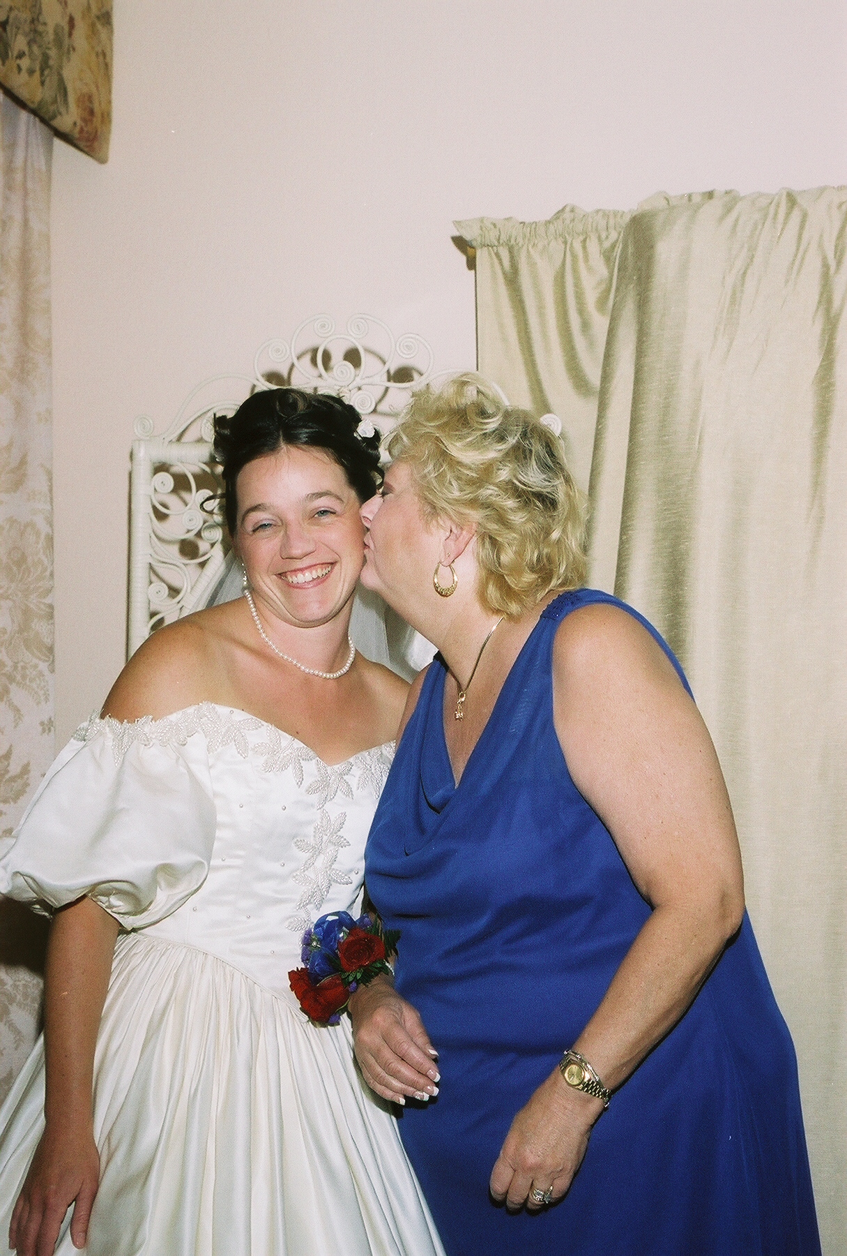 Erin being kissed by her mom