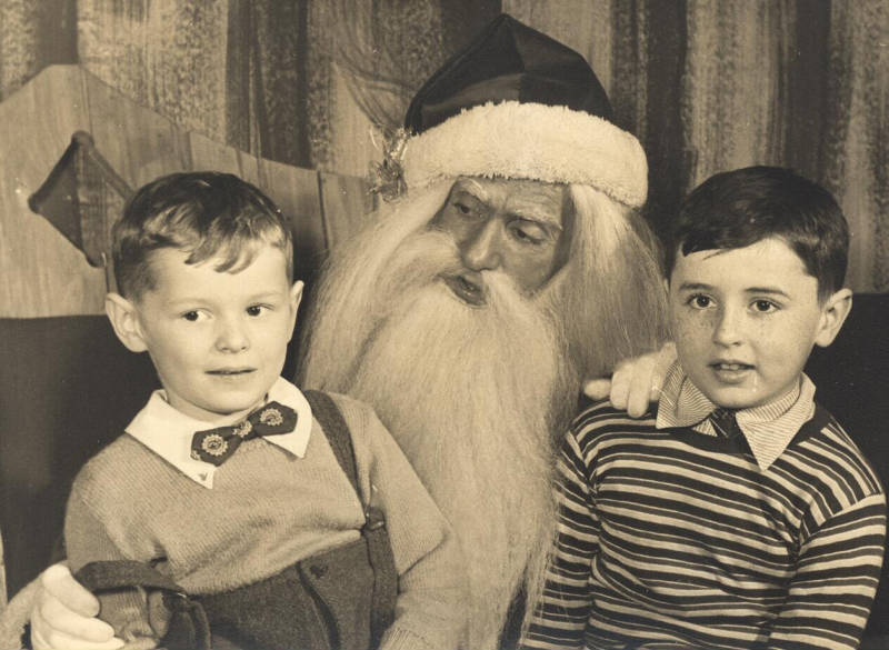 Uncle Neil and Dad, with the scariest Santa Claus ever.
