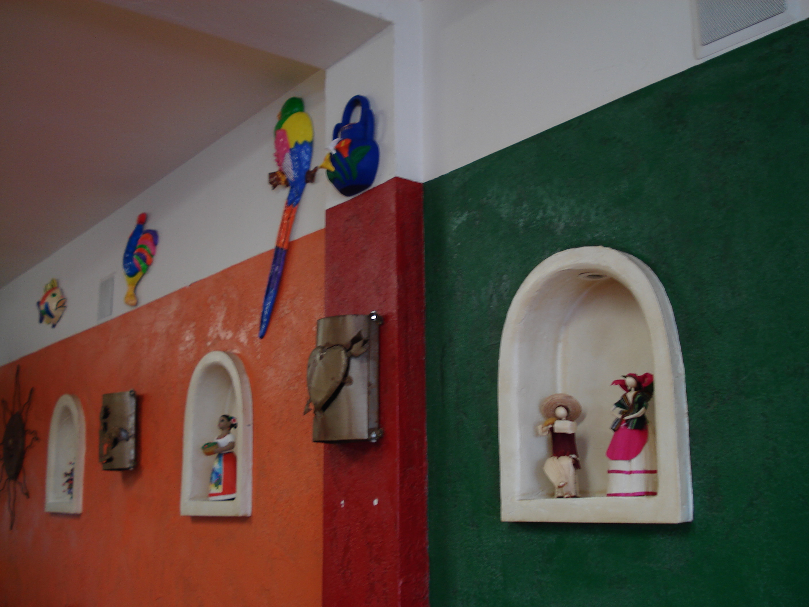 <a href="http://mamatestataqueria.com/">Mamá Testa</a>'s walls are covered in eclectic Mexican decorations.