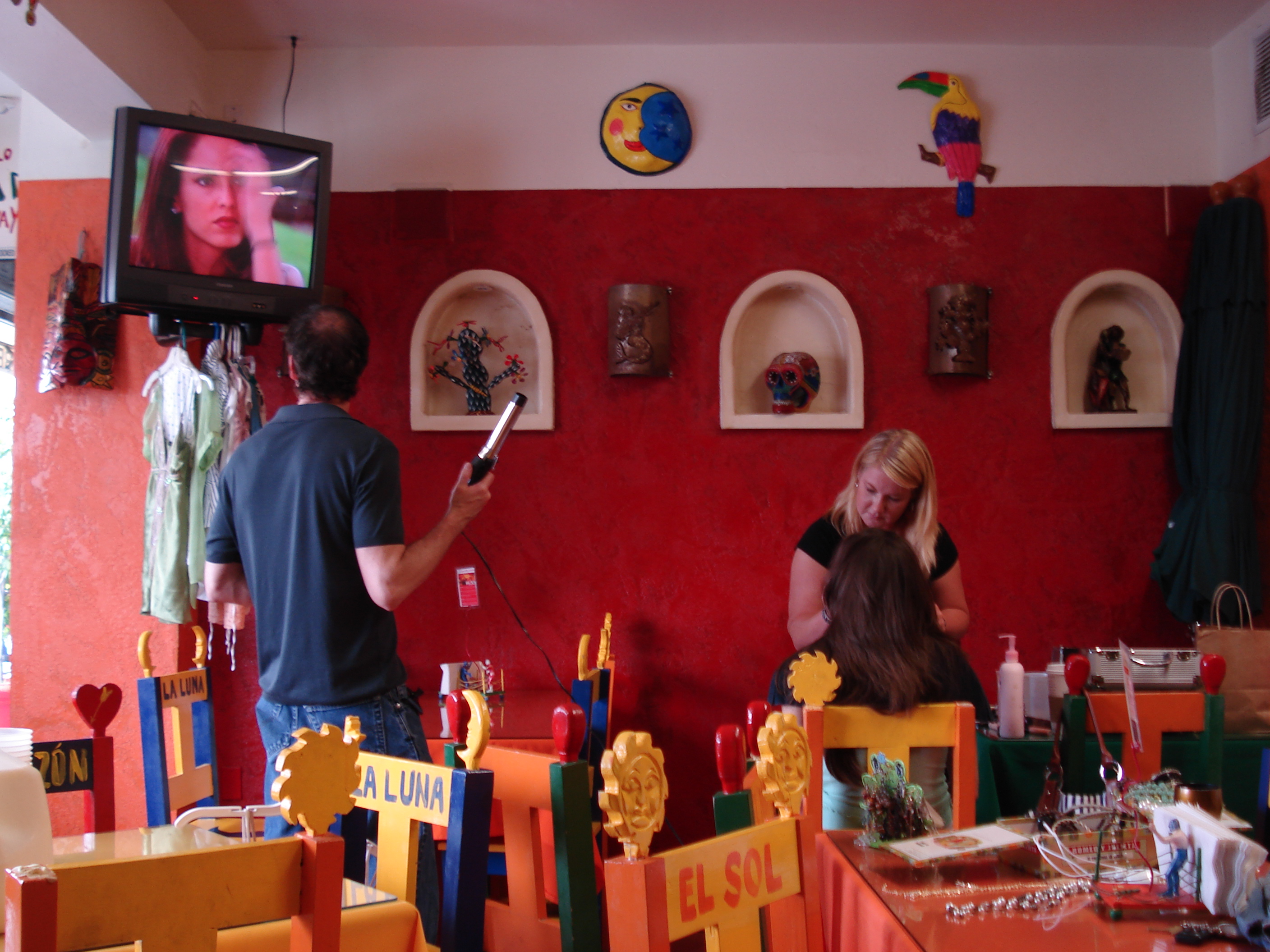 For the commercial, they made up this actress to look like a star in one of the Mexican soap operas (who's on the monitor above). The dude on the left remarked on her eyebrows.