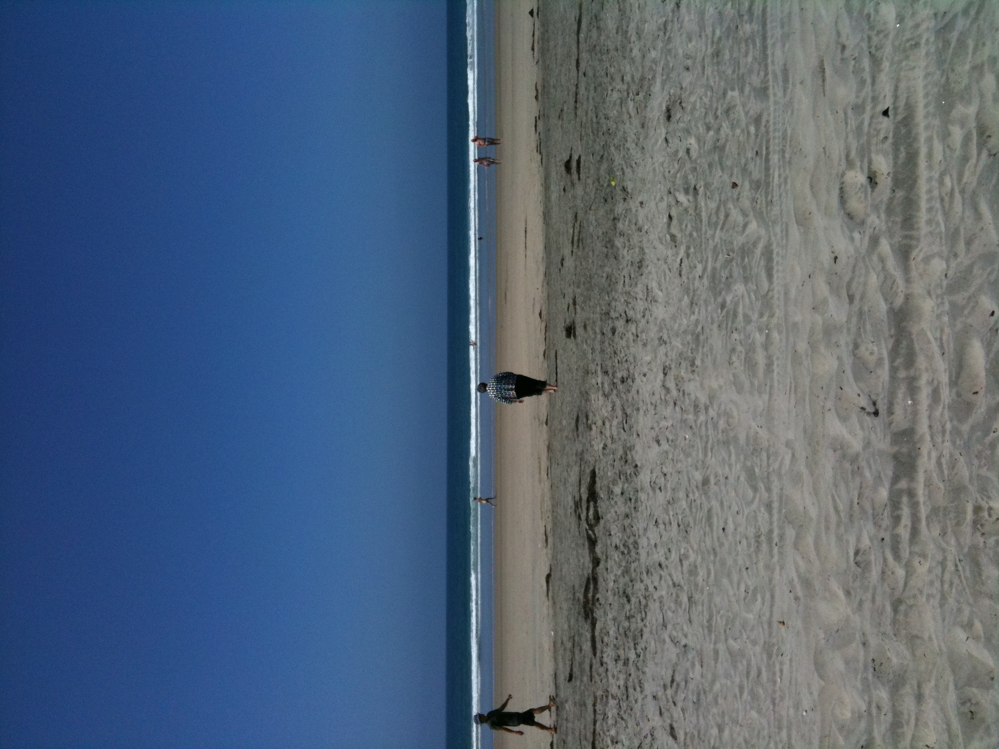Mom, going to dip her toes in the Pacific