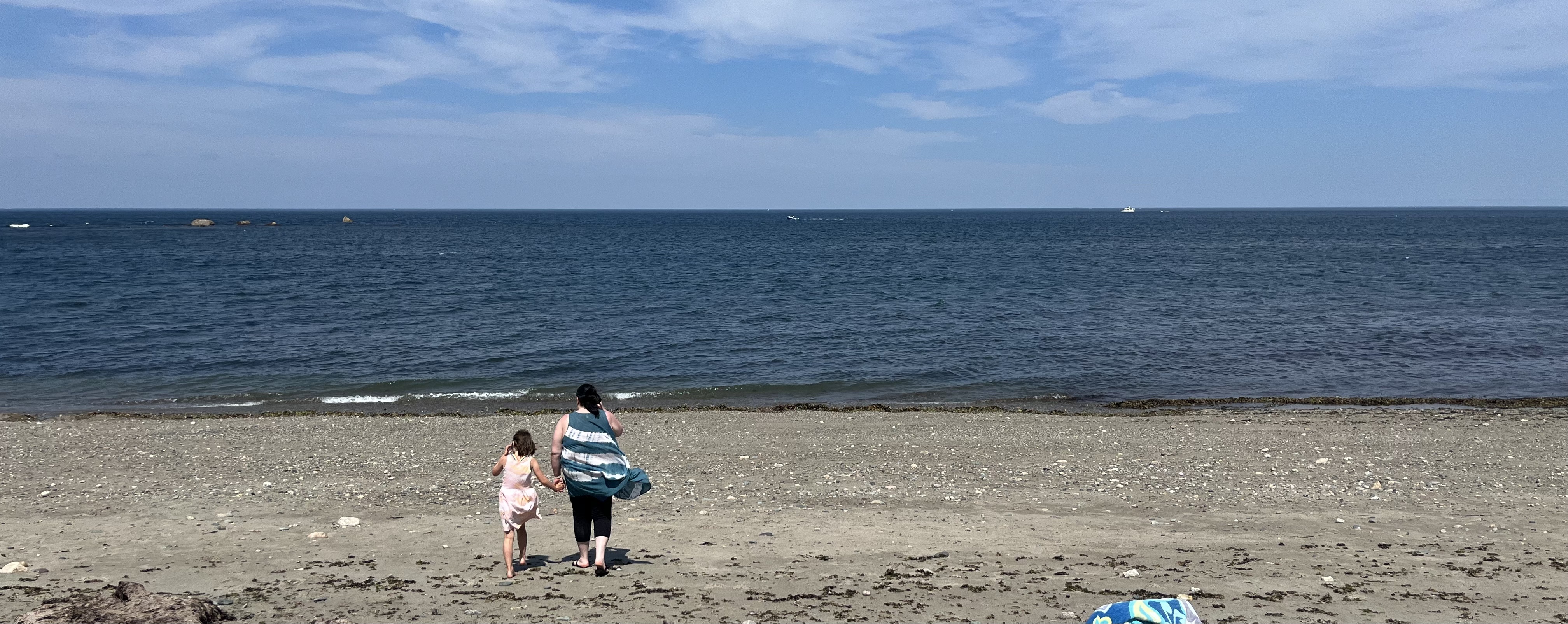 Kathleen walking EJ down to the water at Sandhills