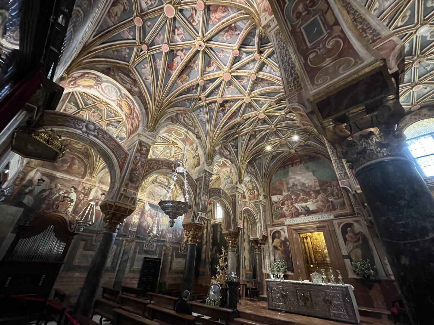An ornate medieval chapel. At first you would asssume this is an entirely different building than the first two photos, but then you see the basic design of the double arches extends into here. This European chapel has been inserted rather directly into the enclosing Moorish building.
