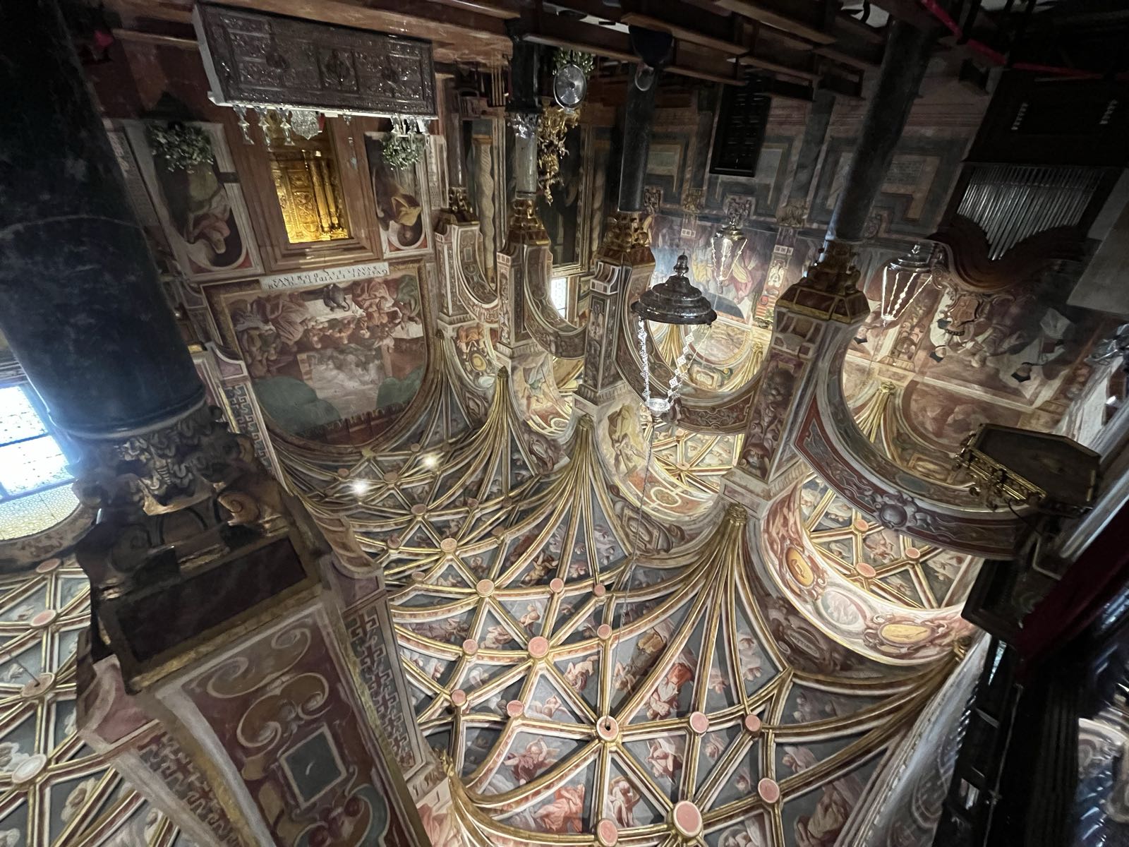An ornate medieval chapel. At first you would asssume this is an entirely different building than the first two photos, but then you see the basic design of the double arches extends into here. This European chapel has been inserted rather directly into the enclosing Moorish building.