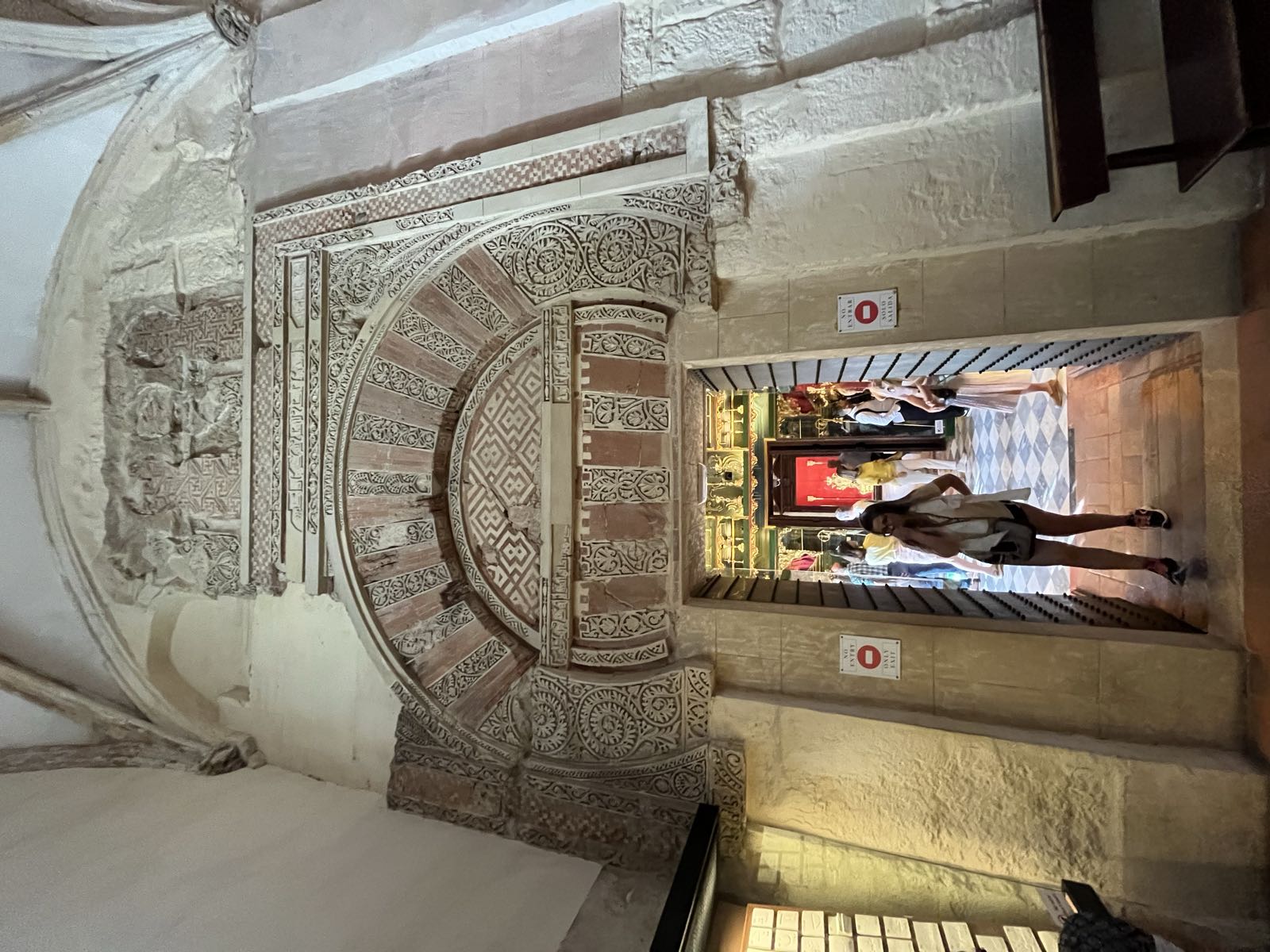 A Moorish doorway through which a European style room appears.