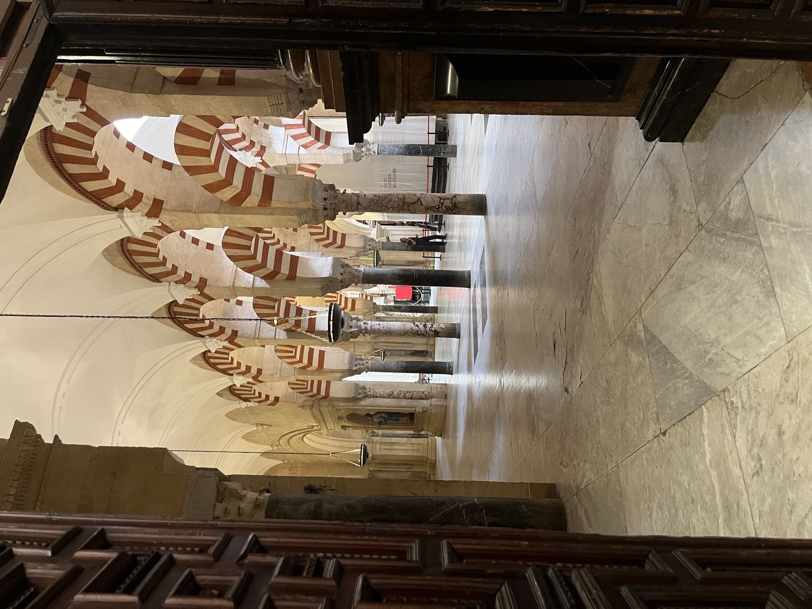 Through one of the doors in that room, the Moorish arches of the hypostyle are visible.