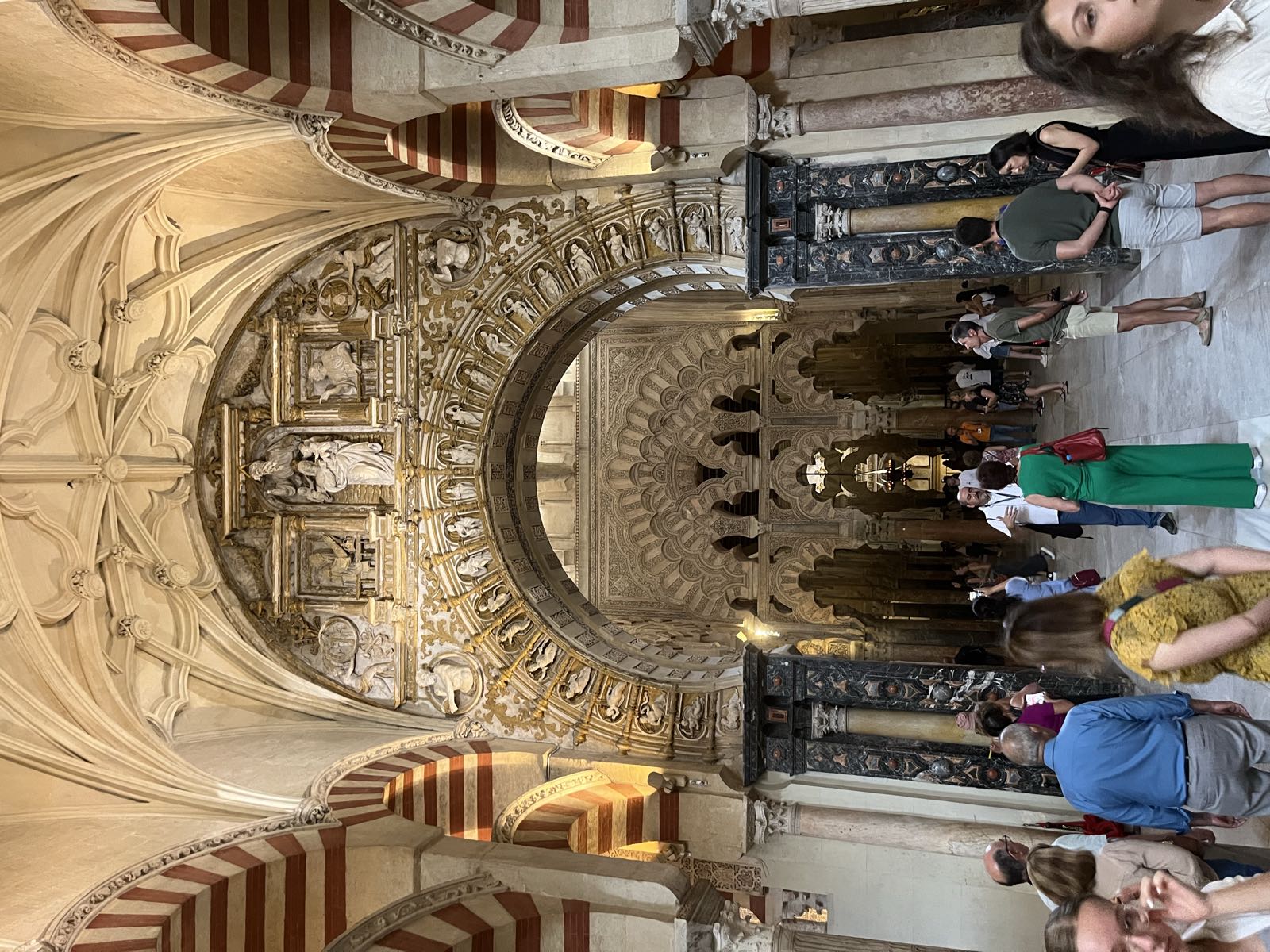 Looking towards the wall with the mihrab from the main cathedral, you can see the different architectural elements of the building at each archway. Visible are some Christian/medieval elements on the nearest archway; beyond it, the ornate Moorish archways of the mihrab.