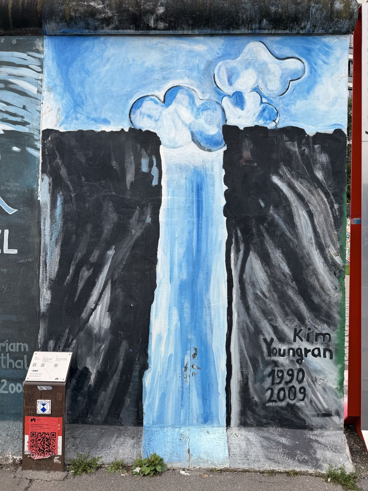 A painting of a vertical hole cut of a wall. A blue, cloudy sky is visible above the wall and through the hole.