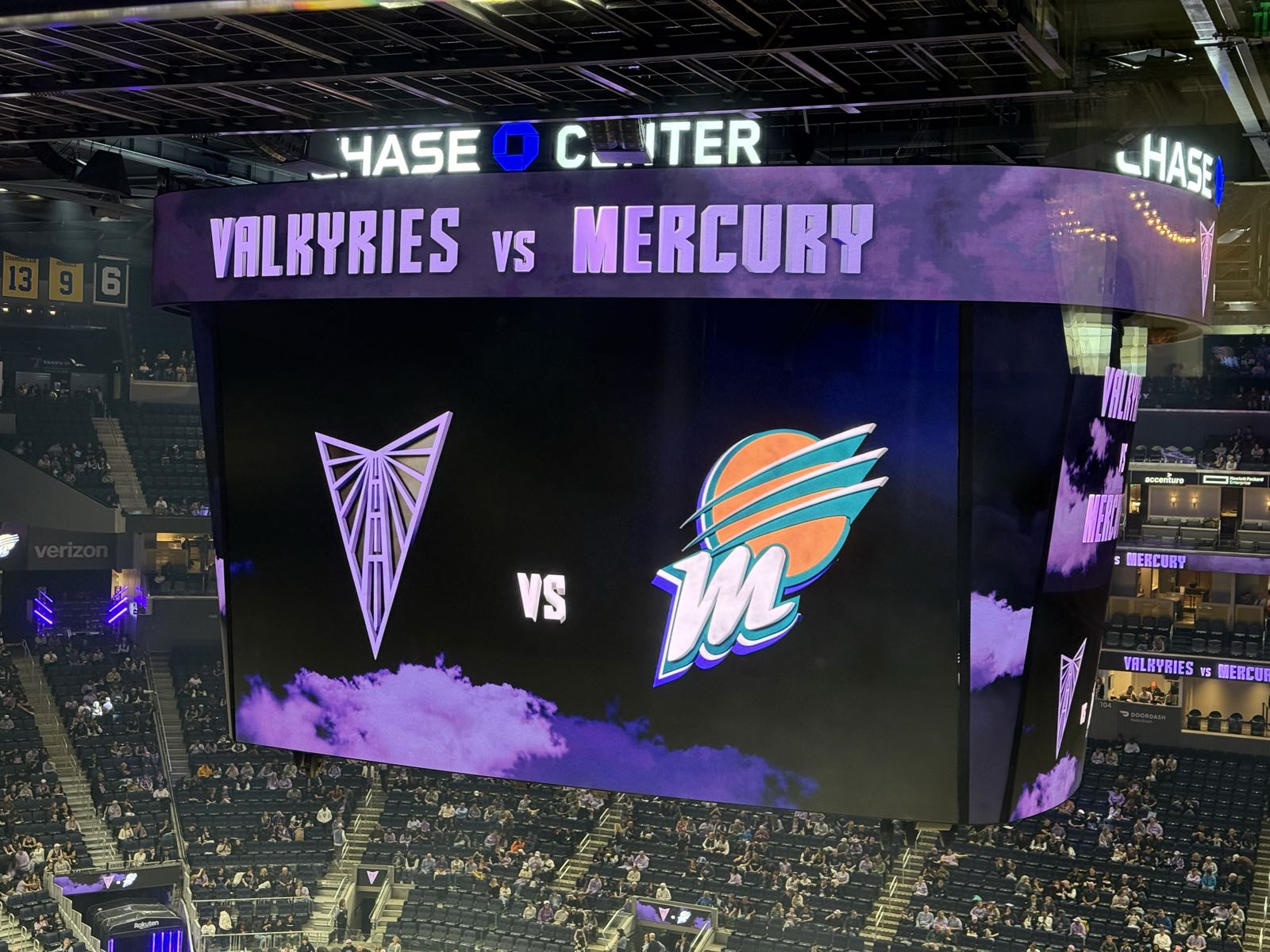 A jumbotron in a basketball arena reads “Valkyries vs. Mercury.”
