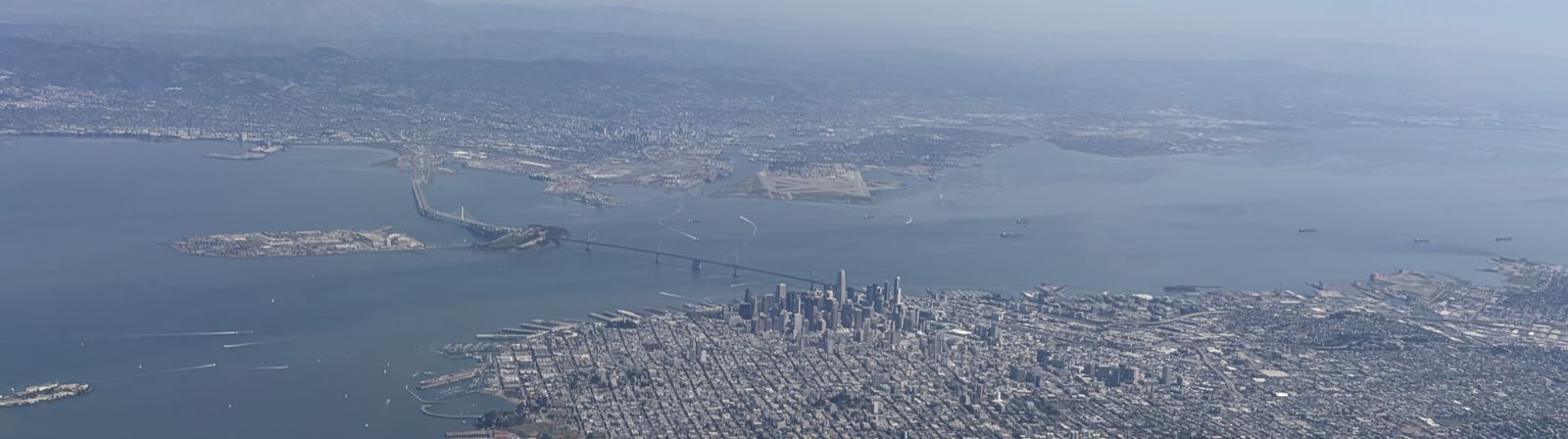 San Francisco, as seen from the air. Alcatraz is in the bottom-left of the picture. Just to the left of center you can see Treasure Island and the Bay Bridge. Downtown SF is in the lower center of the image.