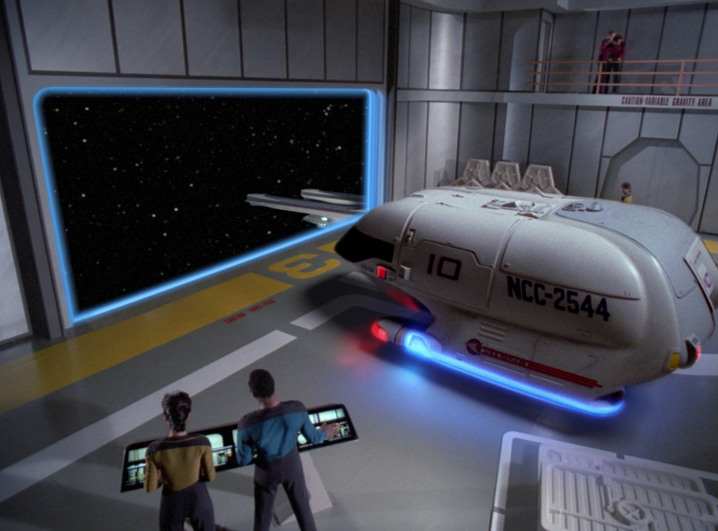 A spaceship is hovering over the floor of a small room. One wall of the room appears to be open to space, but various people are visible in the room without spacesuits on, so presumably there is some kind of invisible barrier over the opening.